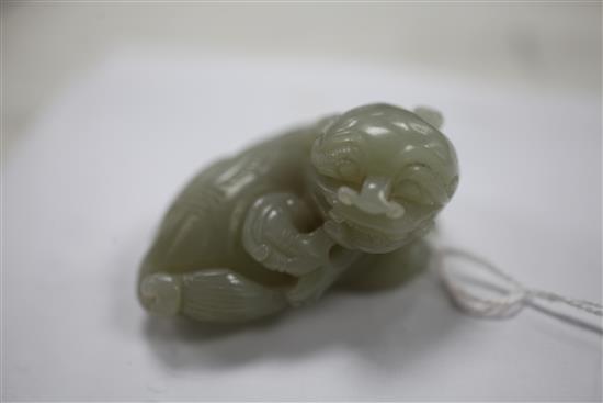 A Chinese celadon jade lion-dog, 19th century, 5.2cm